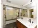 Modern bathroom with dual sink vanity, large walk-in shower with a built-in bench, and stylish fixtures at 4324 Garland Dr, Raleigh, NC 27606