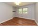 Bedroom with beautiful hardwood floors and a window providing lots of natural light at 4324 Garland Dr, Raleigh, NC 27606