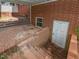 Brick exterior with entrance to the basement and a brick paved patio at 4324 Garland Dr, Raleigh, NC 27606