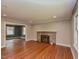 Inviting living room featuring stone fireplace and hardwood floors with recessed lighting at 4324 Garland Dr, Raleigh, NC 27606
