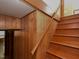 Wooden stairway with wood paneling and painted risers lead to the upper floors at 4324 Garland Dr, Raleigh, NC 27606