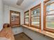Bright sunroom with multiple windows and built in shelving at 4324 Garland Dr, Raleigh, NC 27606