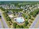 Stunning aerial view showcasing the community pool, clubhouse, and surrounding neighborhood at 449 Christian Creek Pl, Cary, NC 27519