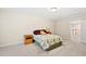 Cozy bedroom with floral bedding, plush pillows and bedside tables; light and airy feel at 449 Christian Creek Pl, Cary, NC 27519