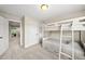 Bedroom featuring a white bunk bed with storage and closet at 449 Christian Creek Pl, Cary, NC 27519
