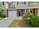 Charming townhome with one-car garage, stone accents, and welcoming front porch at 449 Christian Creek Pl, Cary, NC 27519