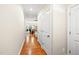Inviting hallway with hardwood floors leading to living and dining areas at 449 Christian Creek Pl, Cary, NC 27519