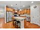 Well-appointed kitchen featuring an island and stainless steel appliances at 449 Christian Creek Pl, Cary, NC 27519