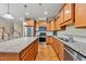 Open kitchen with stainless steel appliances and a large island at 449 Christian Creek Pl, Cary, NC 27519