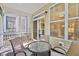 Relaxing screened in porch with seating area, perfect for enjoying the outdoors at 449 Christian Creek Pl, Cary, NC 27519