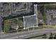 Aerial view showing property boundaries and nearby commercial and residential areas at 4503 Hopson Rd, Morrisville, NC 27560