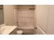 Clean, bright bathroom featuring a bathtub with shower and sink at 50 Atlas Dr, Youngsville, NC 27596