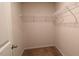 A well-organized closet space featuring built-in shelving for efficient storage solutions at 50 Atlas Dr, Youngsville, NC 27596