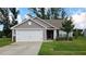 Charming single-story home with a two-car garage and well-manicured lawn at 50 Atlas Dr, Youngsville, NC 27596