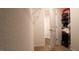 Hallway with carpeted floors and a closet for storage at 50 Atlas Dr, Youngsville, NC 27596