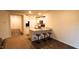 Open-concept kitchen featuring granite countertops, white cabinetry, and a breakfast bar with seating at 50 Atlas Dr, Youngsville, NC 27596