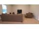 Cozy living room with neutral tones, plush carpet, and a comfortable seating arrangement at 50 Atlas Dr, Youngsville, NC 27596