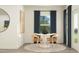Cozy dining area with modern table, seating for four, and natural light from a window at 594 Roy Adams Rd, Angier, NC 27501