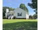 Charming one-story home with manicured lawn, brick foundation, white siding, and inviting front porch at 6 Boxley Dr, Wendell, NC 27591