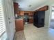 Functional kitchen with stainless steel appliances, brown cabinets, vinyl flooring, and modern fixtures at 6 Boxley Dr, Wendell, NC 27591
