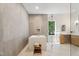 Modern bathroom features a sleek soaking tub, glass shower, and elegant finishes at 6701 Green Hollow Ct, Wake Forest, NC 27587