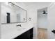 Bright bathroom features a modern sink with black hardware and an elegant, large black framed mirror at 6701 Green Hollow Ct, Wake Forest, NC 27587