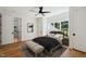 Cozy bedroom features natural light, ceiling fan, and en-suite bathroom access at 6701 Green Hollow Ct, Wake Forest, NC 27587