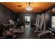Well-equipped home gym with modern exercise machines and equipment, designed for a complete workout experience at 6701 Green Hollow Ct, Wake Forest, NC 27587