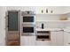 Bright kitchen showcases stainless steel appliances, including double ovens and wine fridge at 6701 Green Hollow Ct, Wake Forest, NC 27587