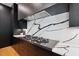 Gourmet kitchen with marble backsplash, sleek gas cooktop, and modern appliances at 6701 Green Hollow Ct, Wake Forest, NC 27587