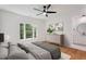 Comfortable main bedroom featuring a ceiling fan, dresser and ensuite bathroom at 6701 Green Hollow Ct, Wake Forest, NC 27587