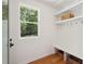 Functional mud room features built-in bench, hooks, and ample natural light at 6701 Green Hollow Ct, Wake Forest, NC 27587