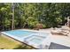 Luxurious pool and spa surrounded by a stone patio, ideal for enjoying sunny days at 6701 Green Hollow Ct, Wake Forest, NC 27587