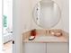 Charming powder room with unique speckled countertop and stylish gold round mirror at 6701 Green Hollow Ct, Wake Forest, NC 27587