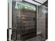 Modern shower with sleek black tiles, glass door, and rainfall showerhead, creating a spa-like experience at 6701 Green Hollow Ct, Wake Forest, NC 27587