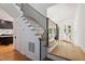 Elegant staircase with wooden treads, modern railing, and abundant natural light at 6701 Green Hollow Ct, Wake Forest, NC 27587