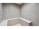 Modern steam room boasts floor-to-ceiling tile work, clean lines, and a built-in bench for ultimate relaxation at 6701 Green Hollow Ct, Wake Forest, NC 27587