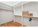 Spacious walk-in closet with custom shelving, providing plentiful storage options at 6701 Green Hollow Ct, Wake Forest, NC 27587