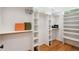 Organized walk-in closet with built-in shelves and ample storage space at 6701 Green Hollow Ct, Wake Forest, NC 27587