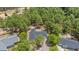 Aerial view of home with dark roof surrounded by lush trees and greenery at 74 Dove Trl Trl, Sanford, NC 27332