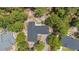 Bird's-eye view of home with dark roof and a spacious lot surrounded by mature trees at 74 Dove Trl Trl, Sanford, NC 27332