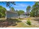 This is a view of the back of the house showing a deck and screened in porch at 74 Dove Trl Trl, Sanford, NC 27332