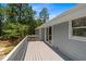 Deck featuring wooden railings offering a great view and glass sliding door access at 74 Dove Trl Trl, Sanford, NC 27332