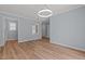 Cozy dining area featuring updated flooring, neutral paint, and modern lighting at 74 Dove Trl Trl, Sanford, NC 27332