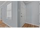 Inviting foyer with hardwood floors, a front door, neutral paint, and a window for natural light at 74 Dove Trl Trl, Sanford, NC 27332