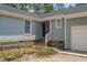 Close up showing the front entrance, steps, and surrounding landscaped area at 74 Dove Trl Trl, Sanford, NC 27332