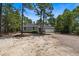 Charming one-story home with a gravel driveway and a two-car garage at 74 Dove Trl Trl, Sanford, NC 27332
