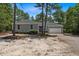 Charming one-story home with a gravel driveway and a two-car garage at 74 Dove Trl Trl, Sanford, NC 27332