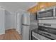 Updated kitchen features stainless appliances, granite counters, undermount sink, and tile backsplash at 74 Dove Trl Trl, Sanford, NC 27332