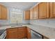 Updated kitchen with stainless appliances, granite counters, and a modern sink at 74 Dove Trl Trl, Sanford, NC 27332